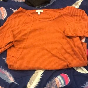 A orange long sleeve shirt